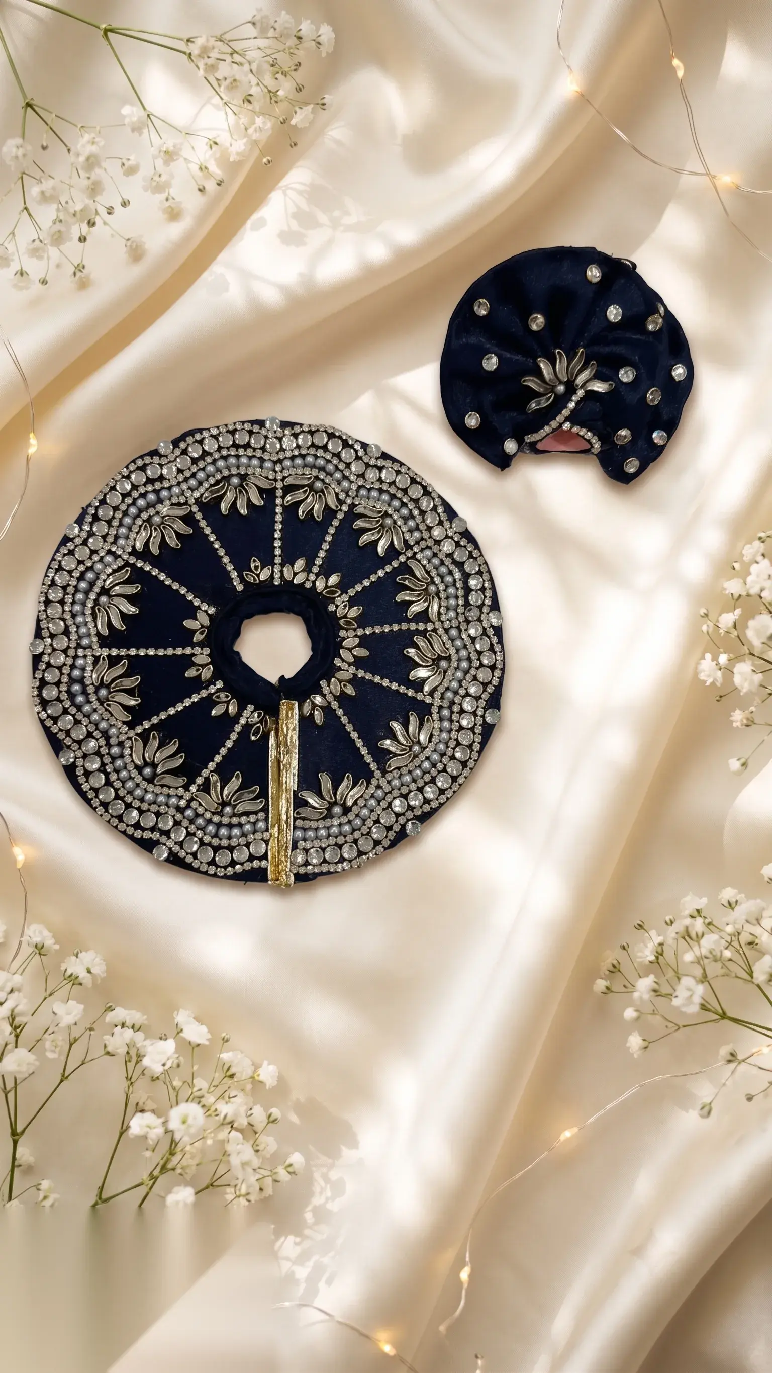 Navy velvet mukut with kundan stonework and beaded trim, paired with a matching pagdi accent piece.